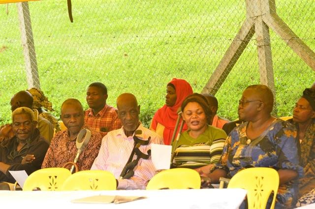 Community members sit and listen attentively during an RDAF session.