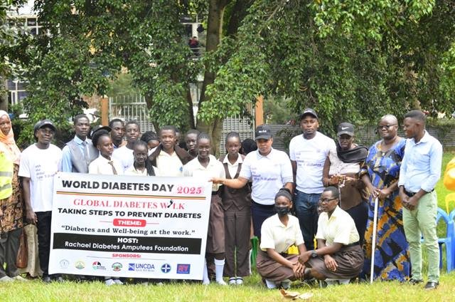 Participants stand together behind an RDAF Global Diabetes Walk banner.